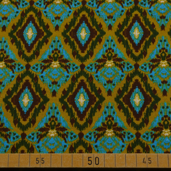 French Terry mit Ikat-Muster in Blau und Braun – elastischer Sweatstoff für Hoodies, Sweatshirts und Kleidung.