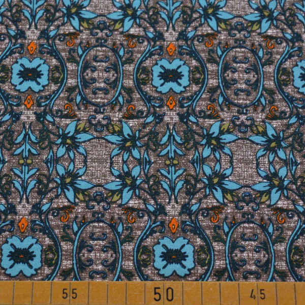 Baumwolljersey mit abstraktem Blumendekor auf dunklem Hintergrund